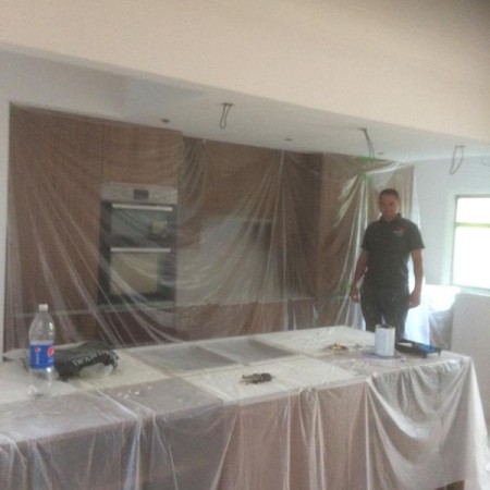 New Kitchen, Muswell Hill, N10. Job included: Lowered ceiling so level, built a level partition to hang the new cabinets, rewiring, down lights, double sockets, tiling and more.